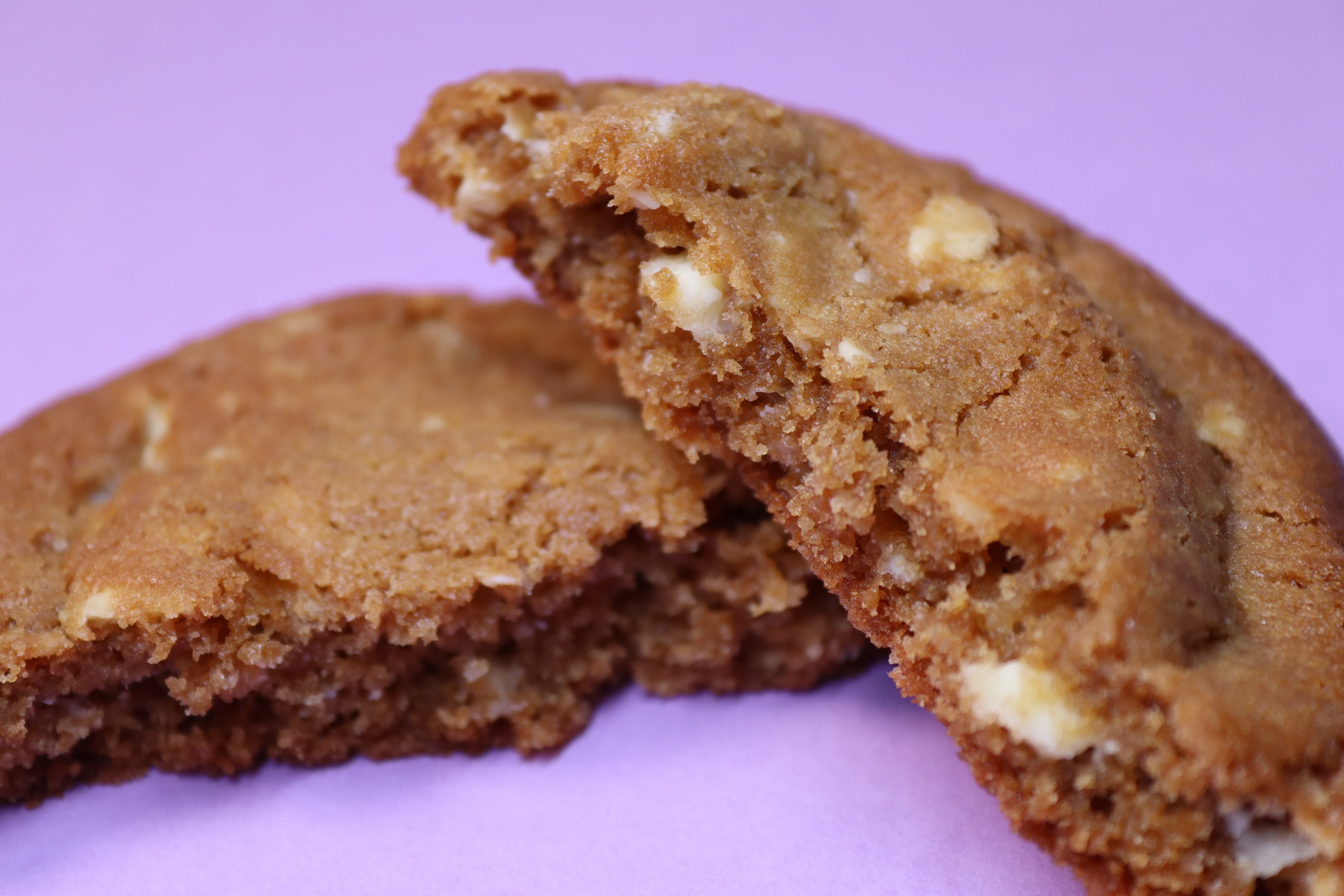 Broken cookie on a lavender background